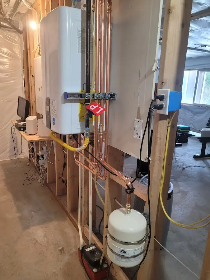 Licensed plumber repairing a kitchen sink in Waupaca
