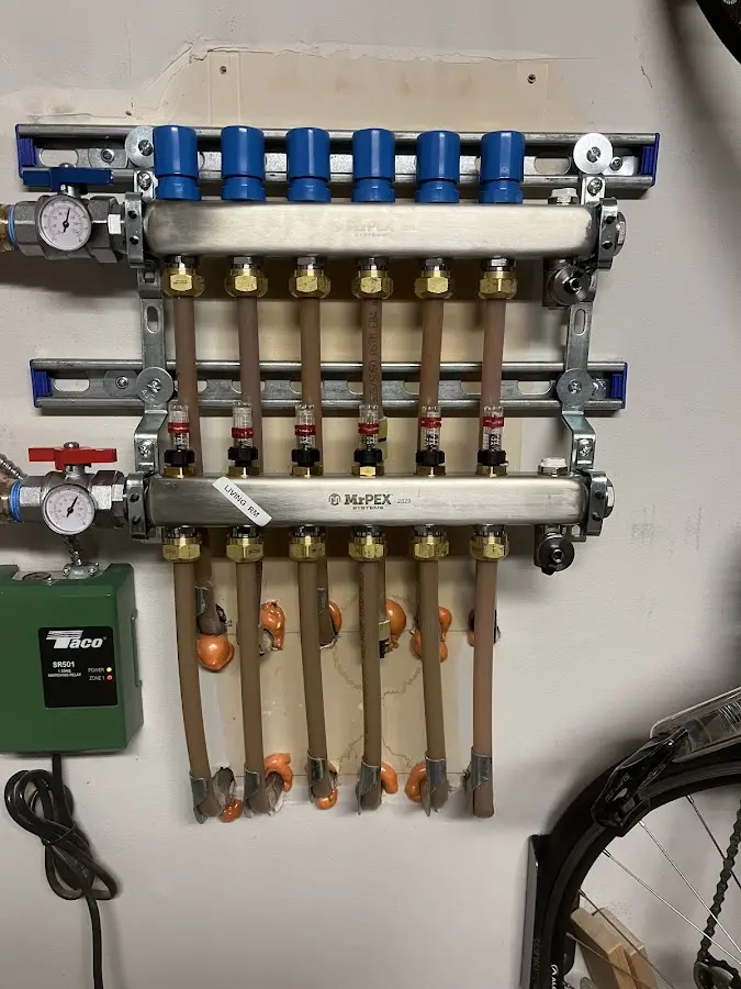 Plumber performing Water Heater Repair at a residential property in Waupaca